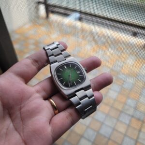 omega genevè green fume dial